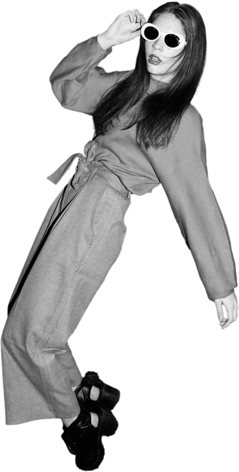 Editorial fashion model in white round sunglasses and a wide-leg trouser set — partner with Insider Edits on digital sample sales