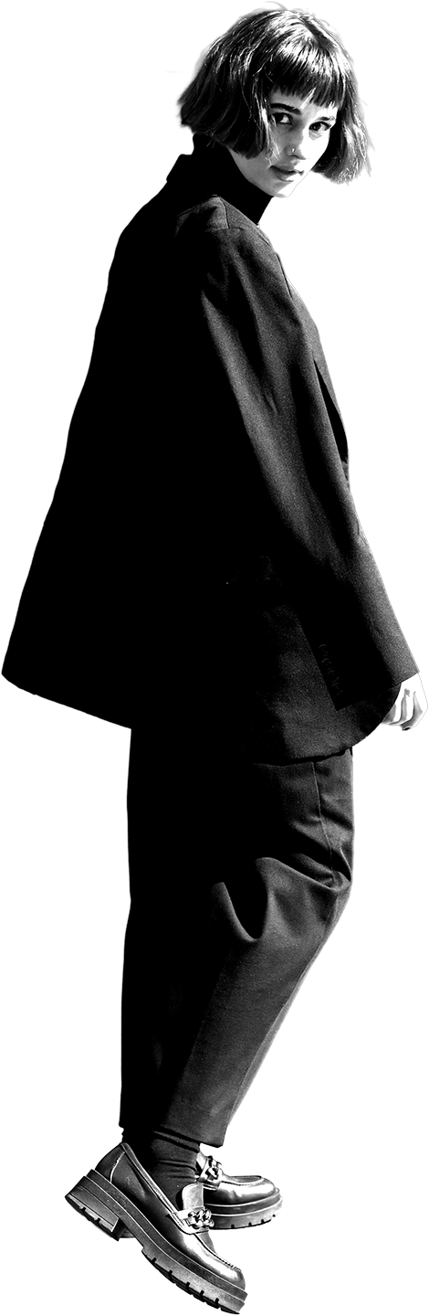 Editorial fashion model in an oversized black tailored suit and chunky loafers — register for Insider Edits sample sale access